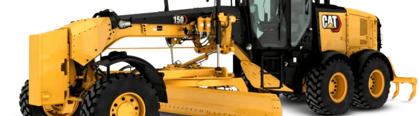 Niveler le sol d’un camion de nivellement sur un chantier de construction, avec des barrières de sécurité et d’autres équipements lourds en arrière-plan.