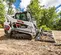 Chargeuse à chenilles compacte BOBCAT blanche, noire et orange 900 à 1 090 kg