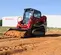 Chargeuse à chenilles compacte Takeuchi rouge et noire