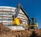 excavatrice JOHN DEERE jaune et grise de 6,5 à 15,4 tonnes