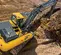 excavatrice JOHN DEERE jaune et grise de 6,5 à 15 tonnes