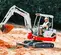 Mini-excavatrice TAKEUCHI blanche, rouge et grise de 1,2 à 1,2 t, balancement de l’arrière zéro