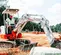 Mini-excavatrice TAKEUCHI blanche, rouge et grise de 1,2 à 1,2 t, balancement de l’arrière zéro