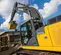 excavatrice JOHN DEERE jaune et grise de 12 à 14 000 kg