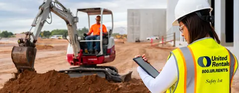Excavatrice de chantier et tablette