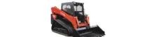 Track loader moving materials on a construction site with visible safety barriers and warning signs in place.