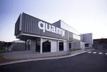 Modern commercial building constructed from stacked shipping containers.